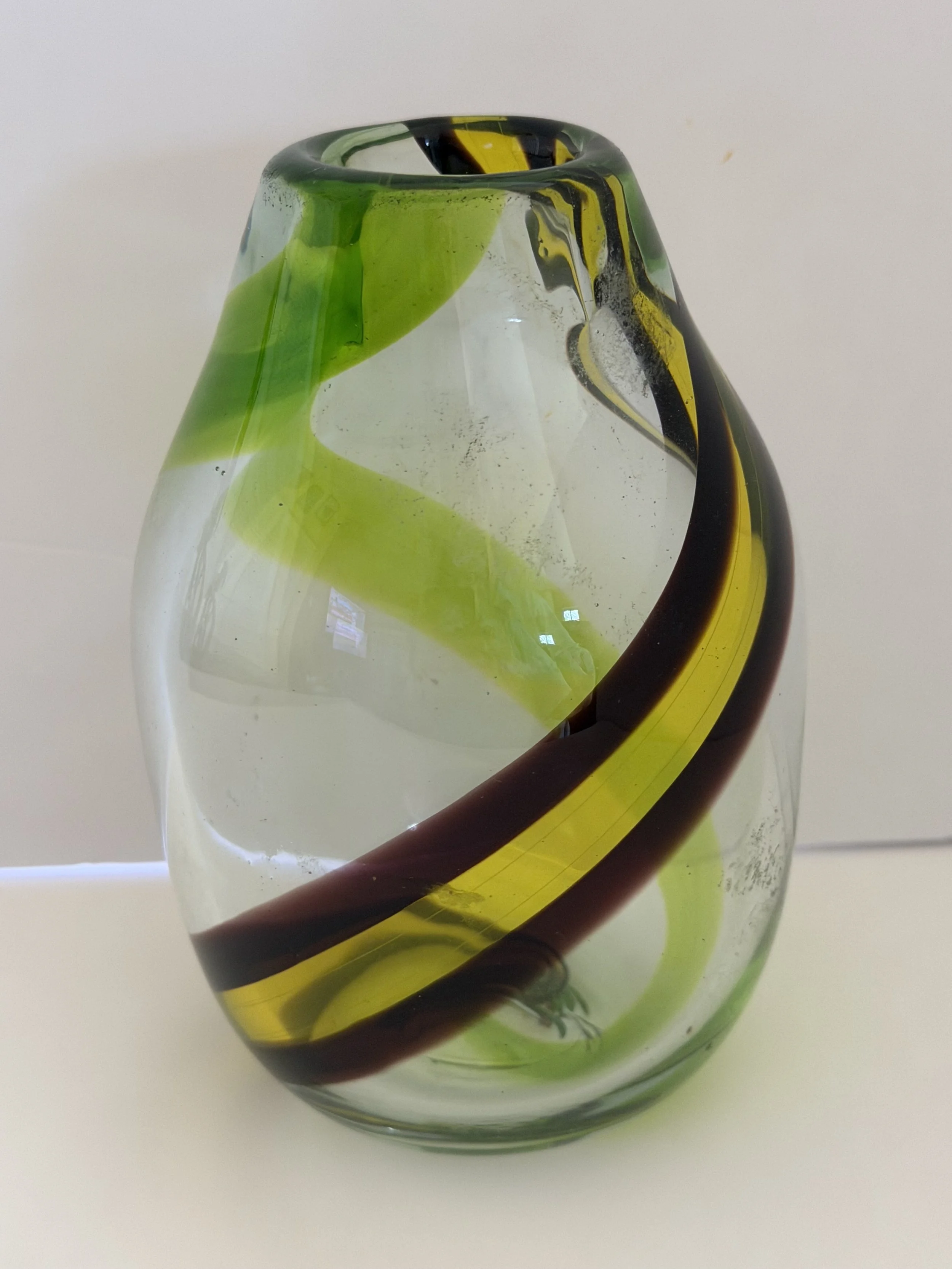 Handblown glass vase: Clear with a yellow-and-brown band plus a green band.