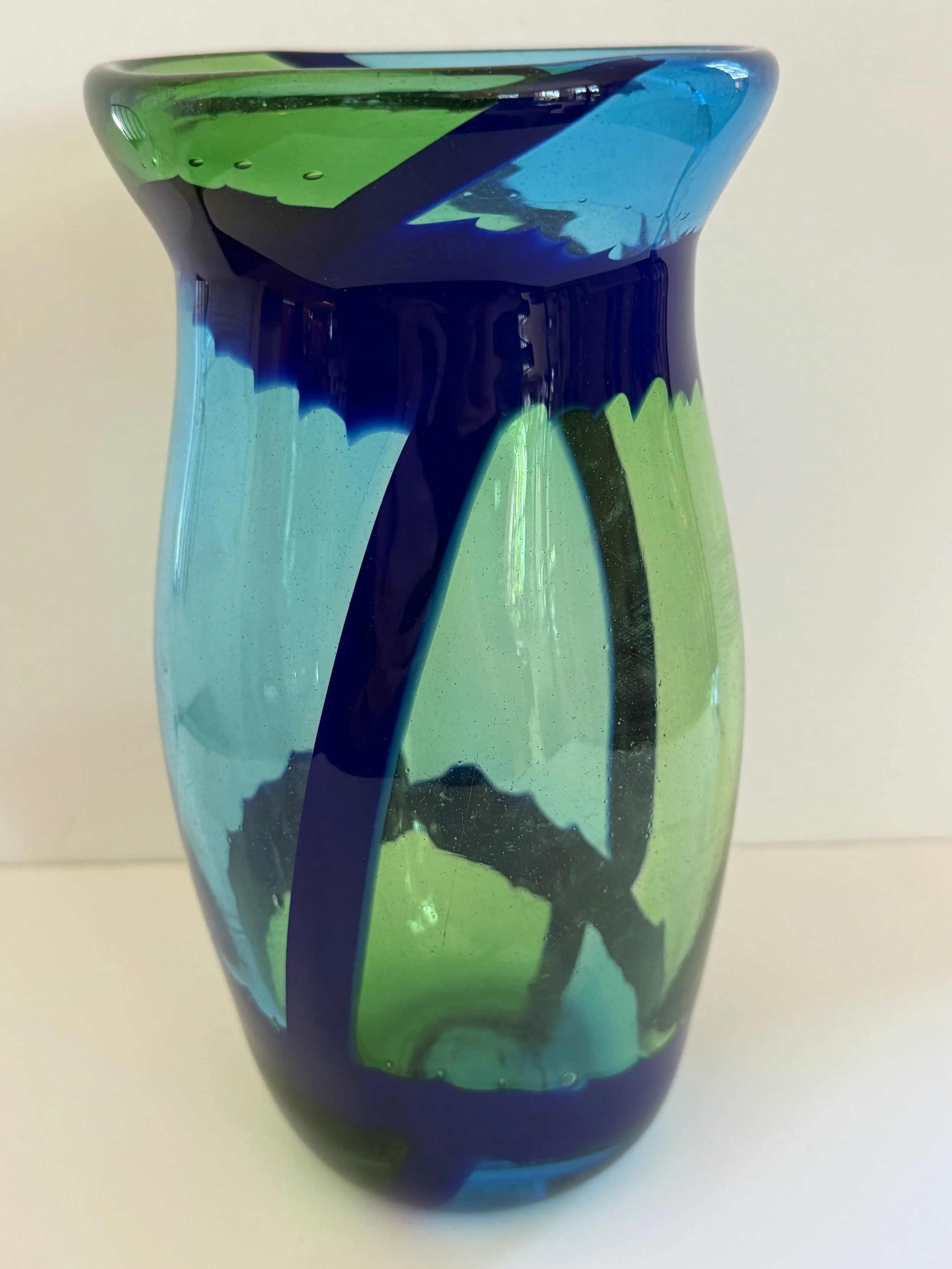 Transparent aqua and light green vase with dark blue borders