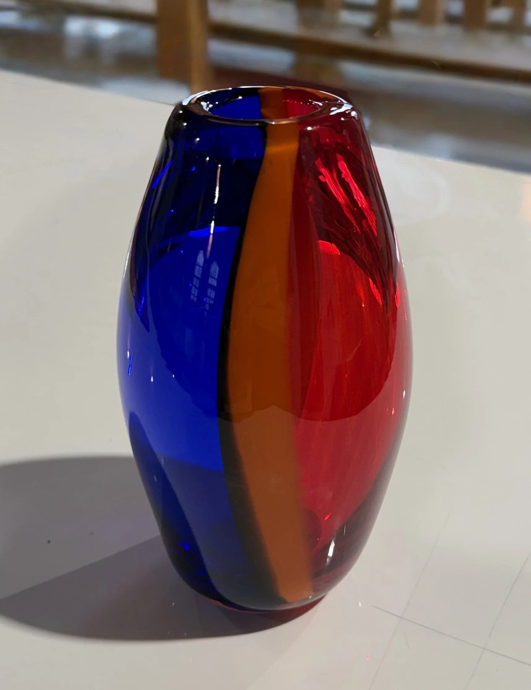 Vertical blue, red and orange stripes