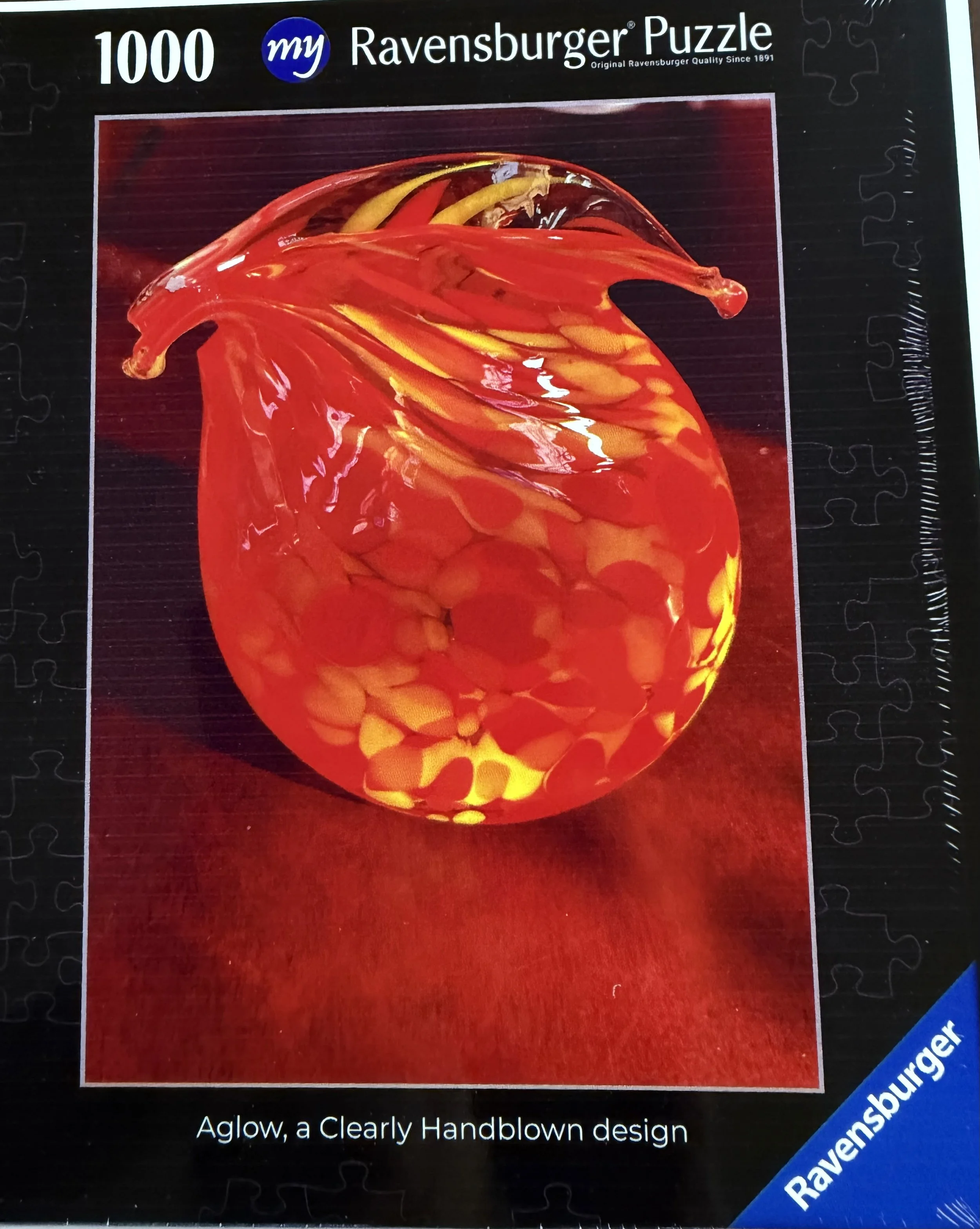Aglow — Ravensburger jigsaw puzzle box.