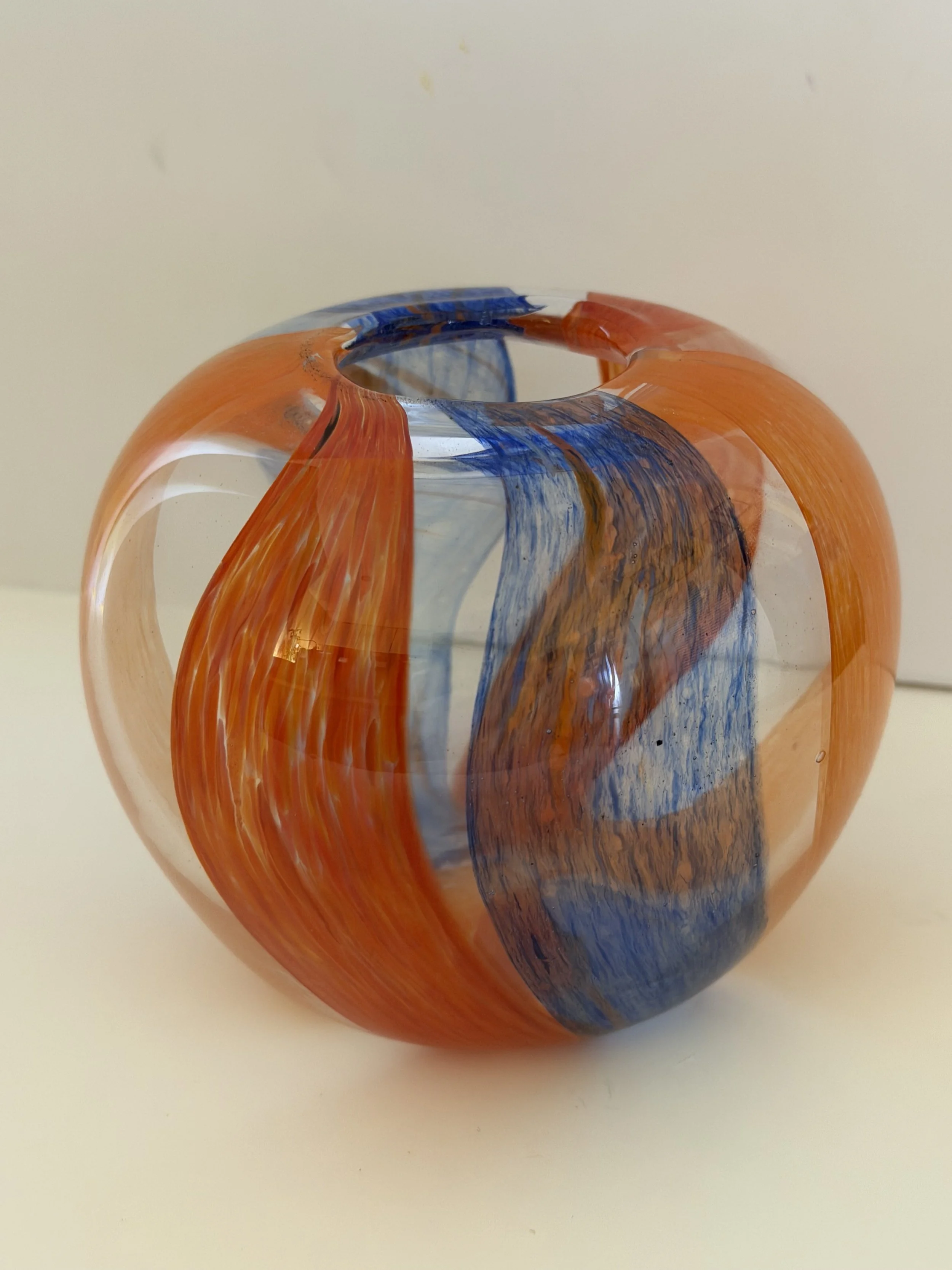 Handblown glass vase, Clear globe with textured red and blue stripes.