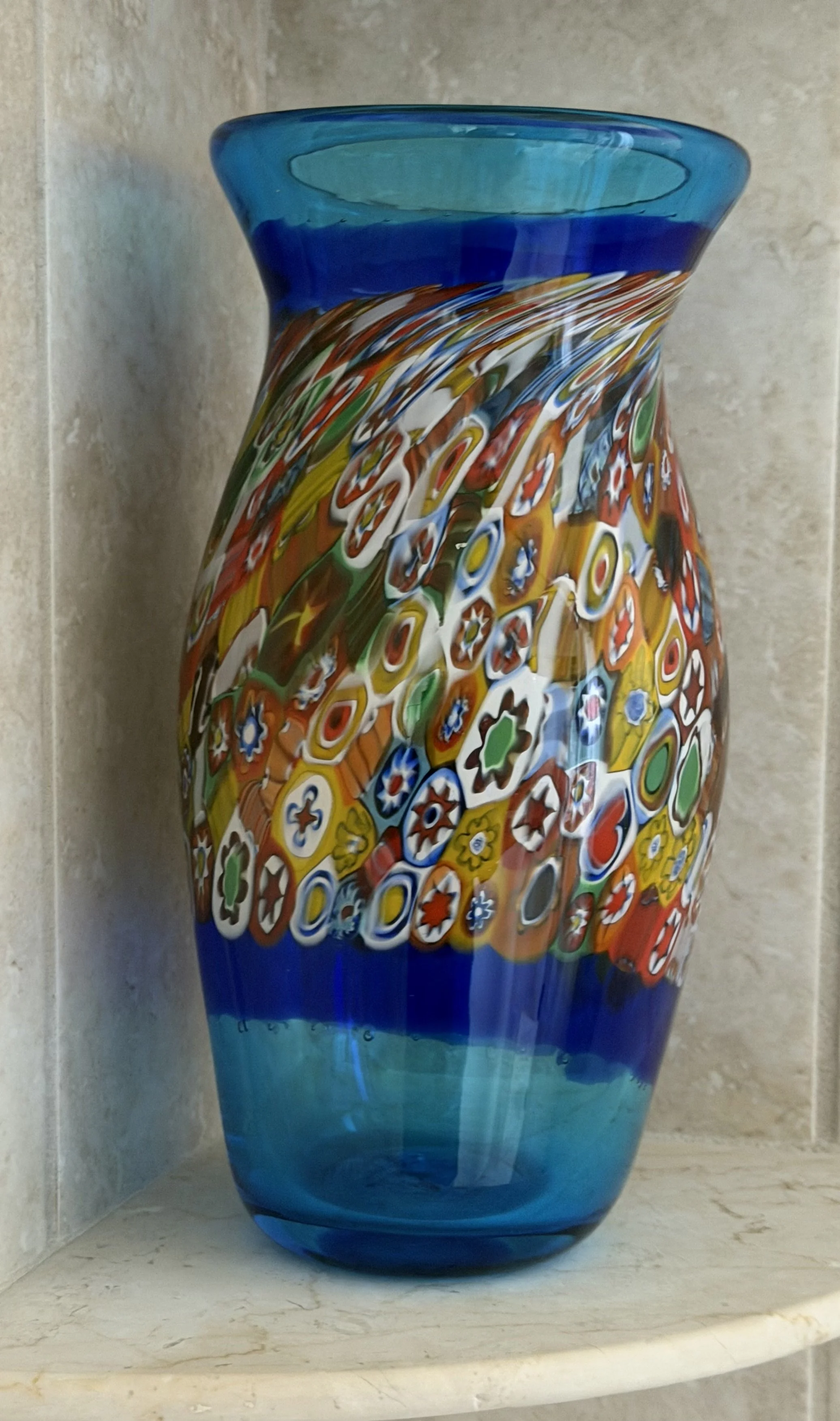 Handblown glass vase, Traditional Italian millefiori bits swirling on cobalt blue.