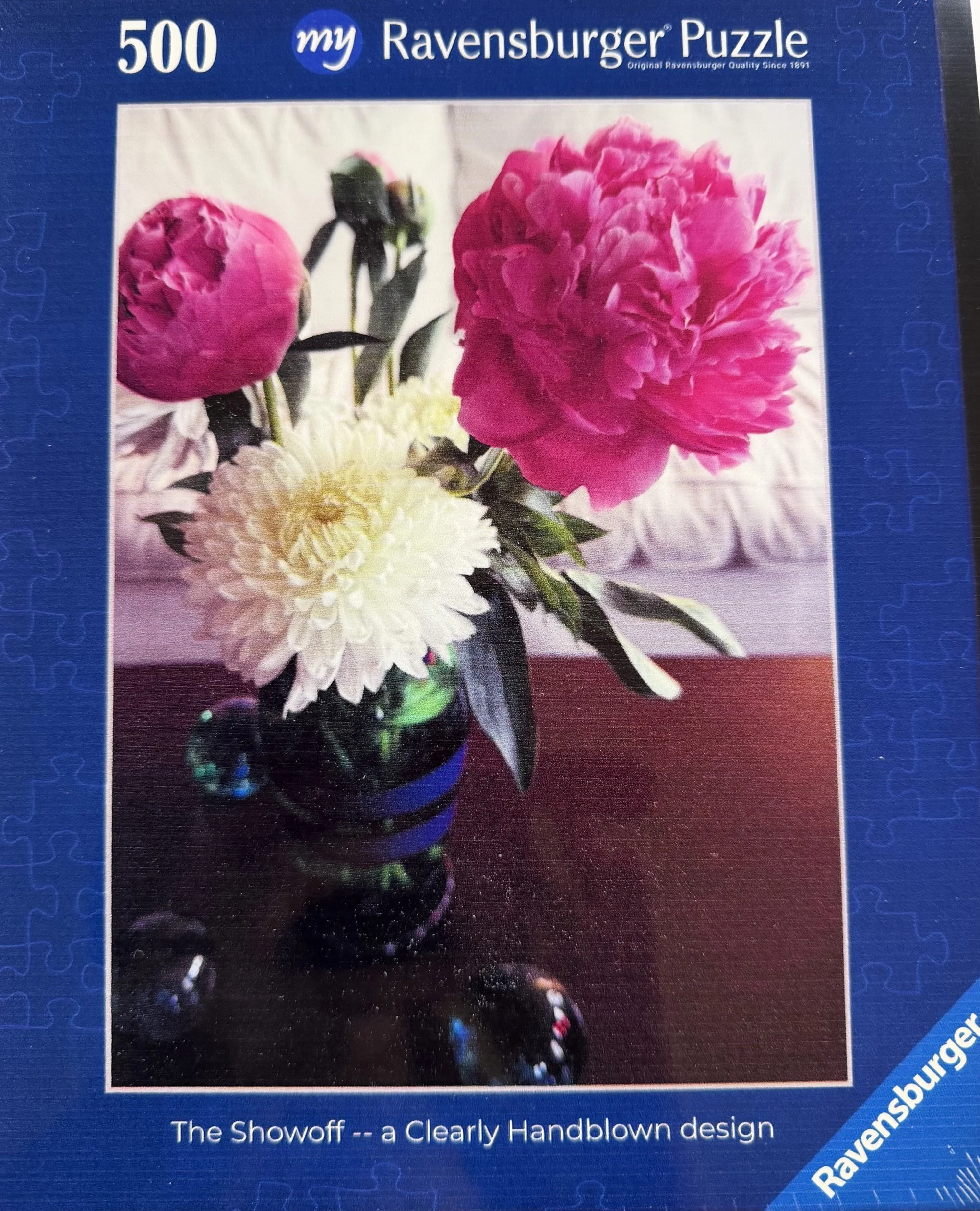 The Showoff — Ravensburger jigsaw puzzle box.