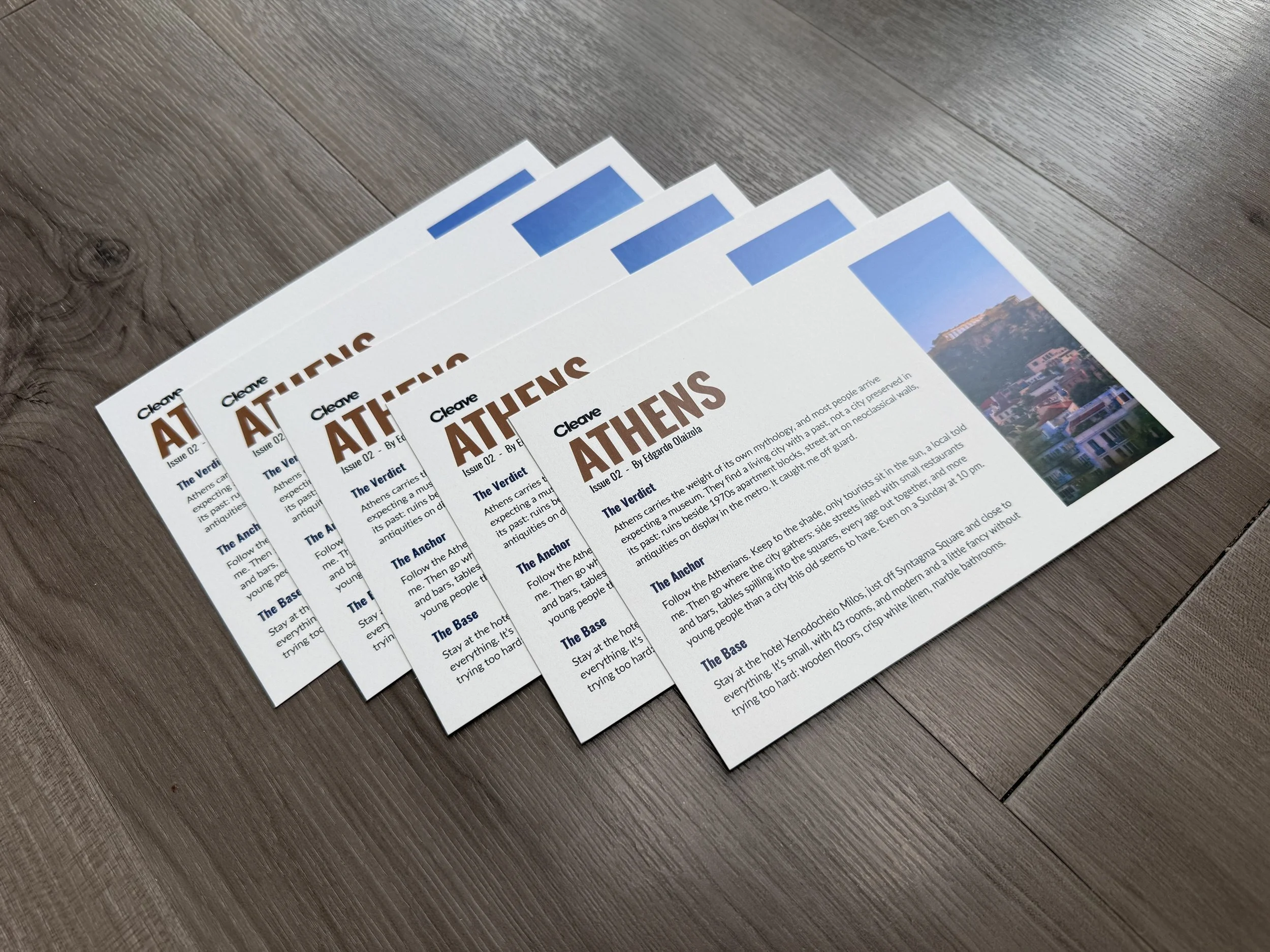 A stack of Cleave 7×5 city cards from a travel snail mail club