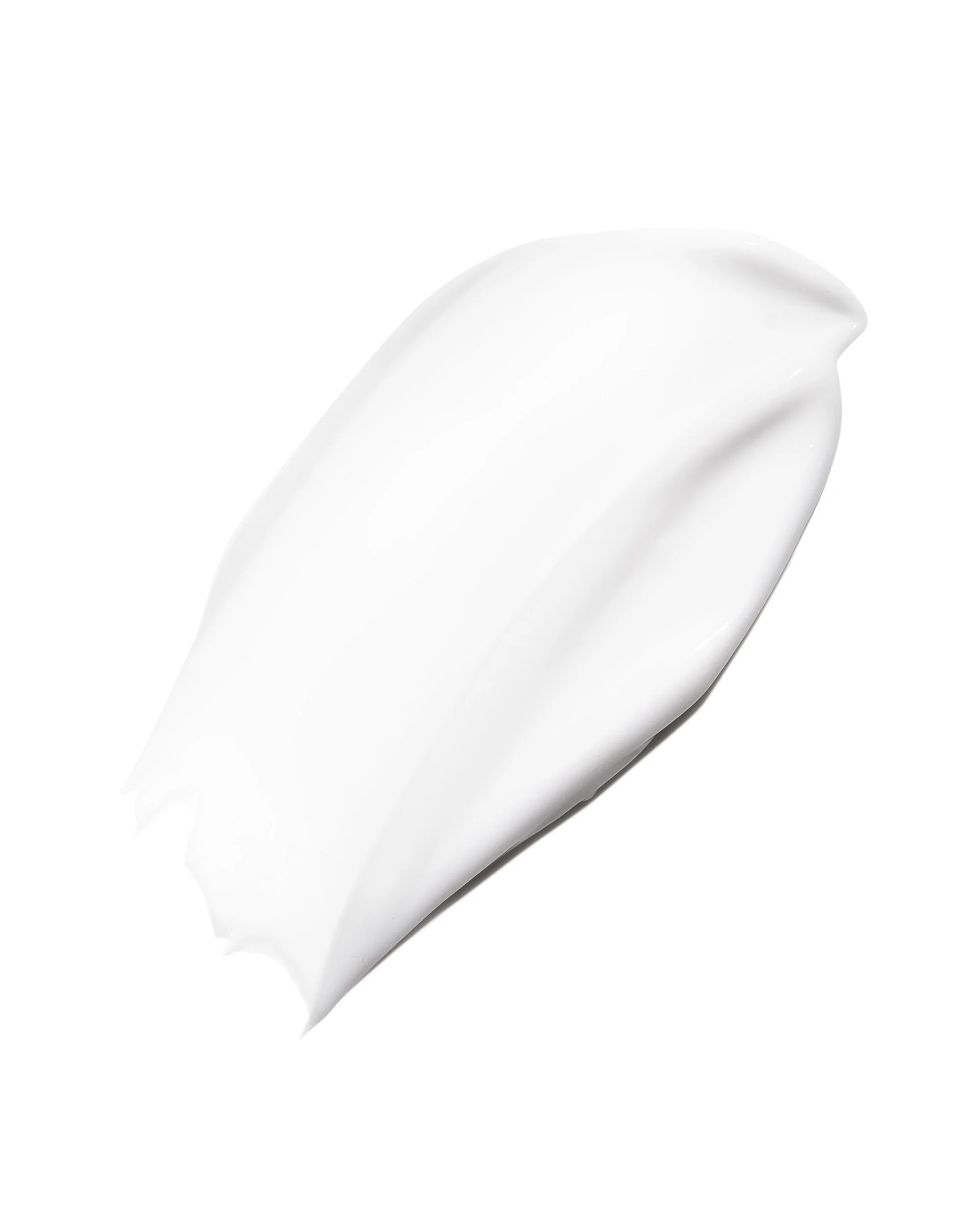 Close-up of a dollop of white cream or lotion on a white surface.