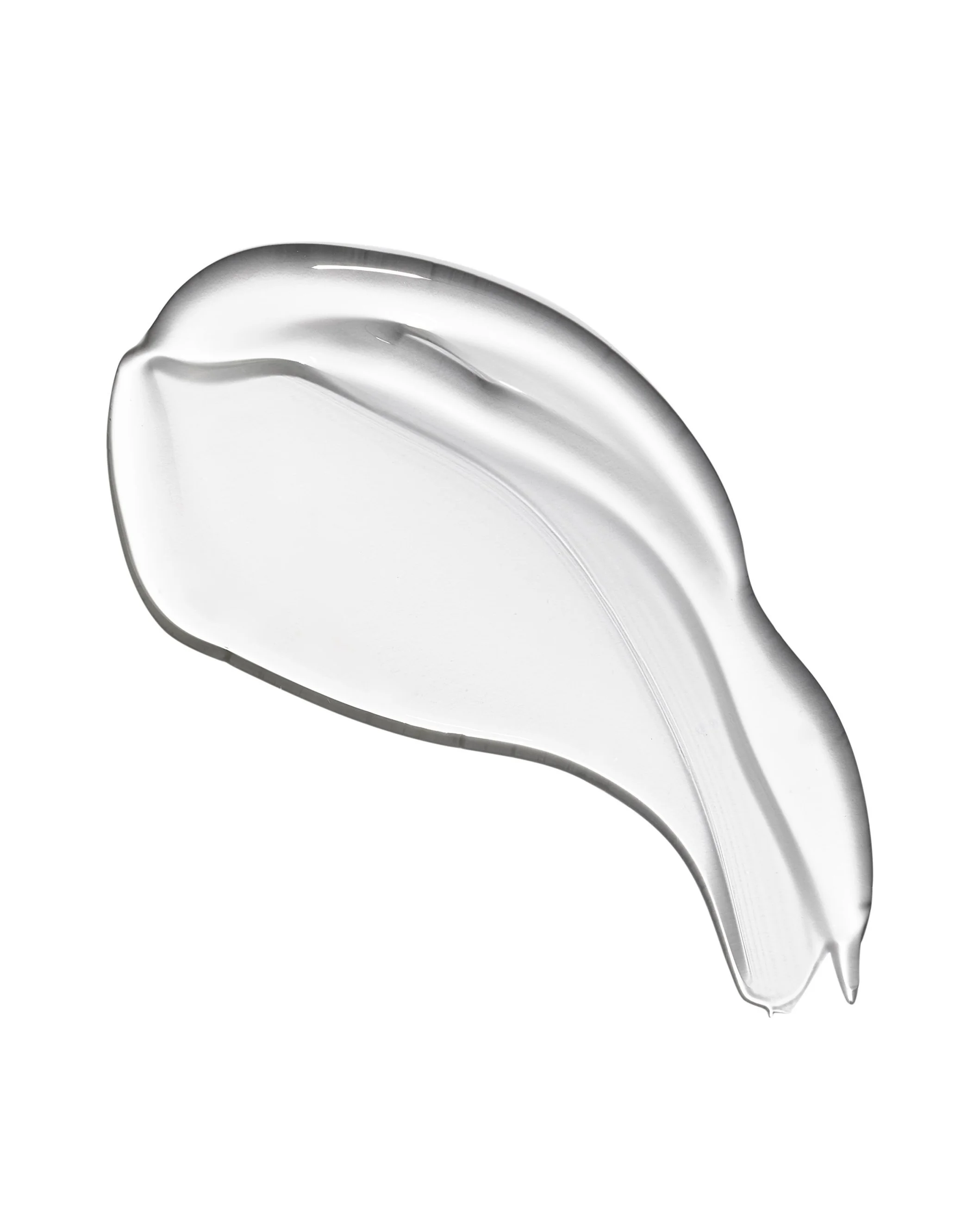Close-up of a clear, curved glass spoon with a hollow handle, isolated on a white background.