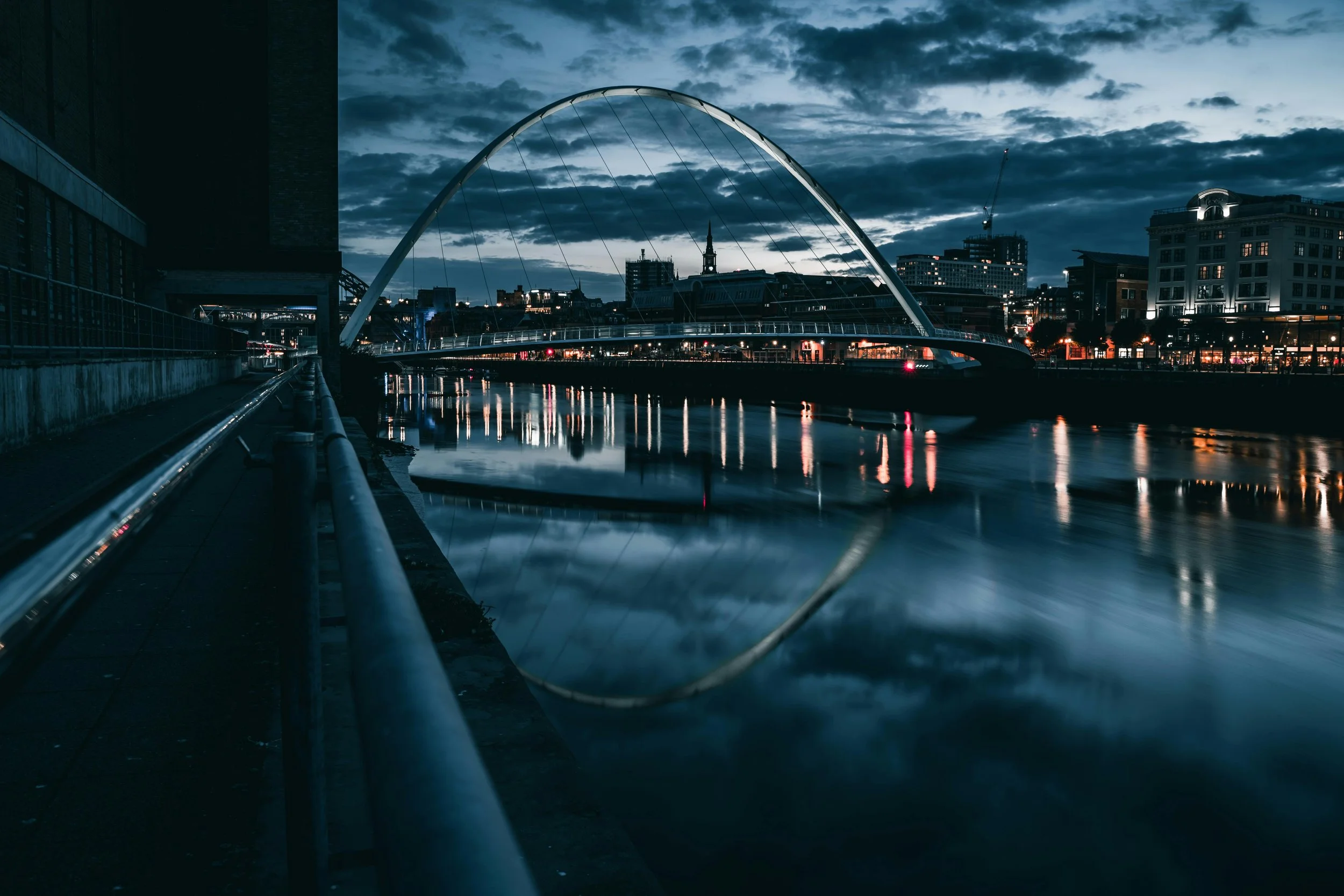 River Tyne at dusk with the Millennium Bridge in the background in Newcastle.