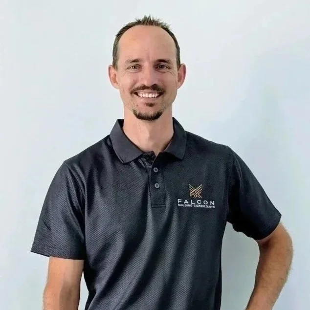 BJ Cilia - Director - Falcon  Building Consultants, wearing a black polo shirt with the Falcon Building Consultants logo.