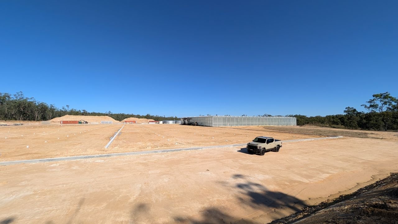 Provenance Propagation construction site - prior to construction. A parked Kia Tasman Ute shows the shear scale of this site being prepared to run commercial greenhouses - under a clear blue sky.