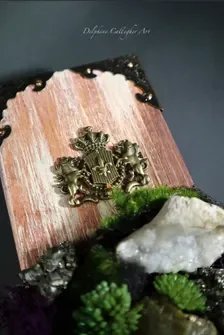 Sculptural gemstone wall art with purple amethyst, quartz and layered botanical textures on natural wood