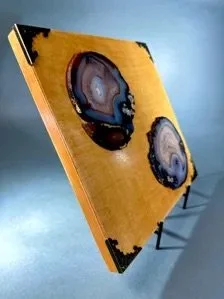 Close-up natural agate slice with grey black and translucent crystalline patterns for gemstone wall art