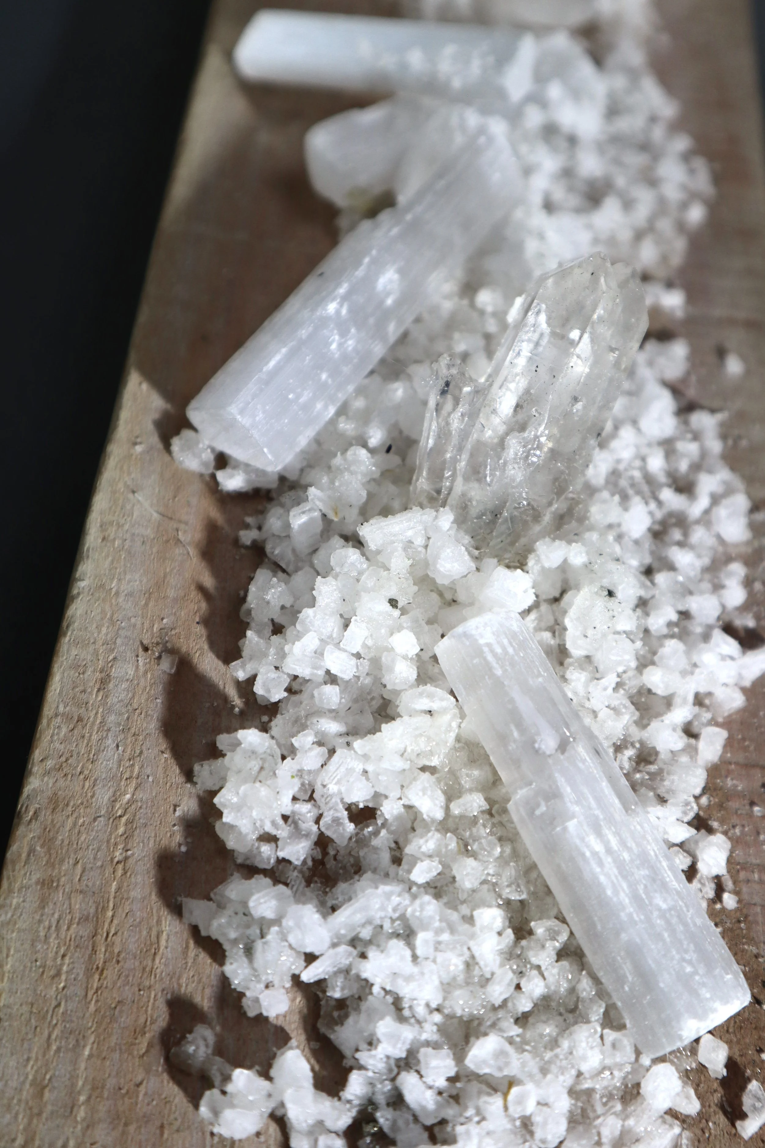 Collectible white mineral wall artwork with geode, selenite and clear quartz in a vertical format