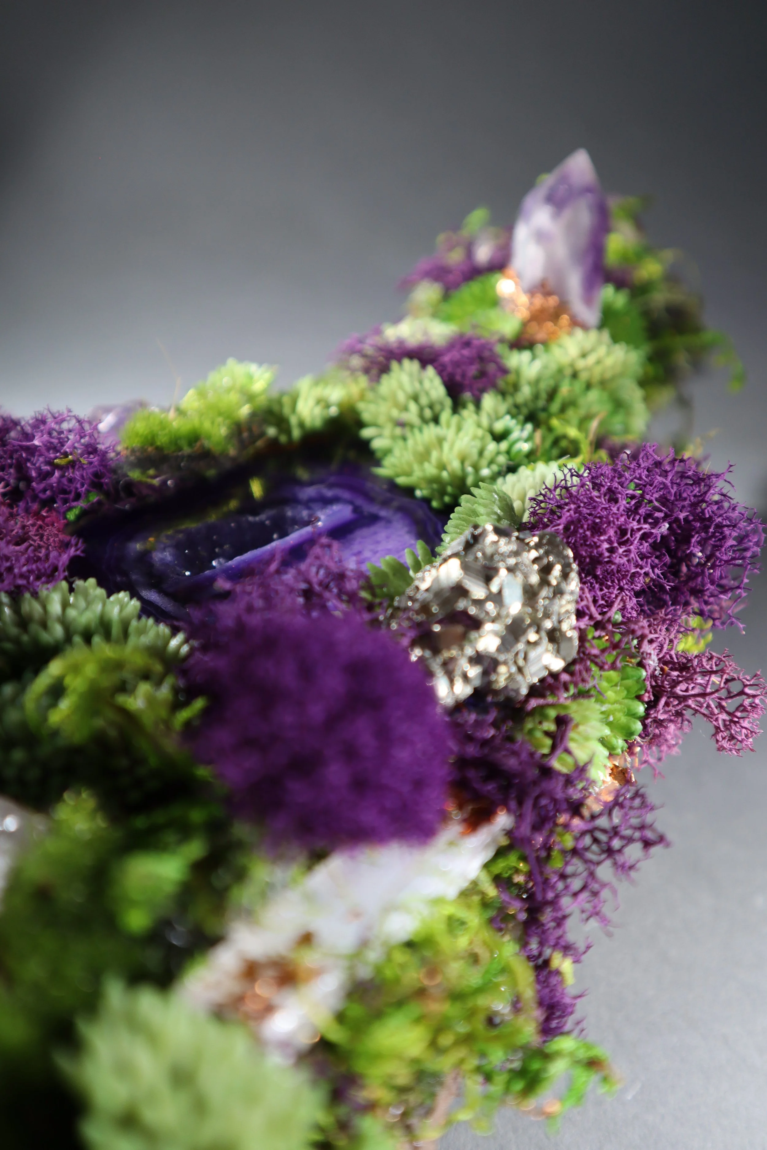 Purple crystal centerpiece with amethyst, pyrite and sculptural botanical textures for unique table decor