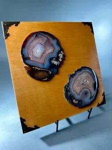 Natural agate slice with layered mineral bands and crystal texture in an original mixed media artwork
