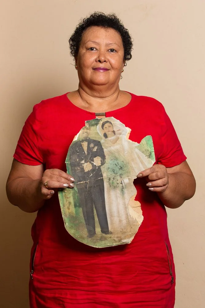 Catherine Mary Yvonne Ledimo holds what is left of the hand-coloured wedding photograph of her parents, band leader Sun Shine Leepile Ledimo and professional ballroom dancer and singer Esme Diona Wright. Esme, who was white, and her mixed-race husban