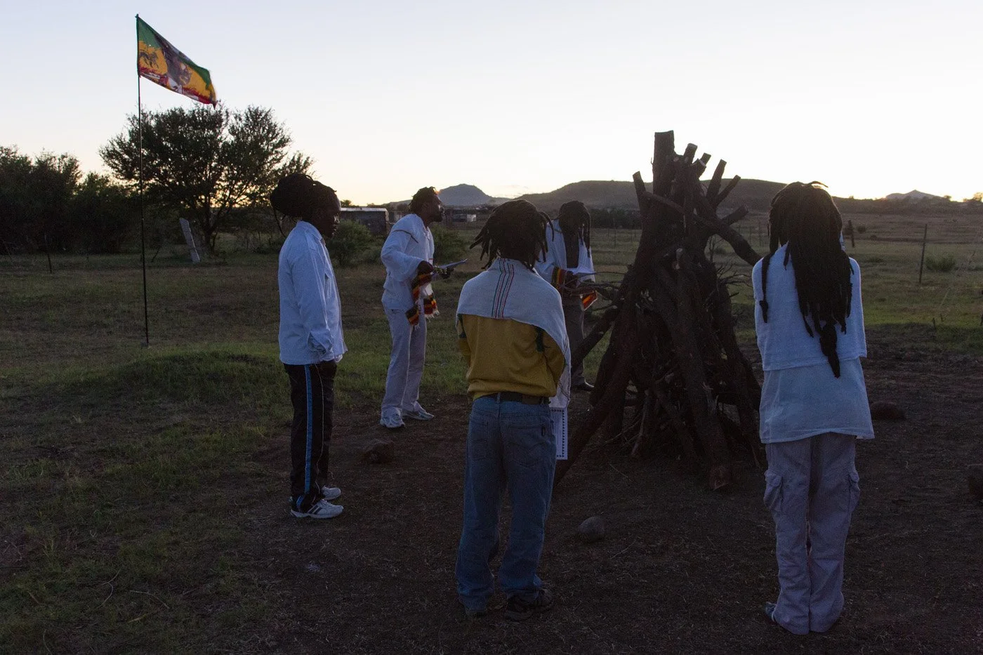 05:03AM. A cold morning in Thaba 'Nchu. The elders stand around the pyre where the community has gathered at first light to celebrate Ethiopian Christmas.