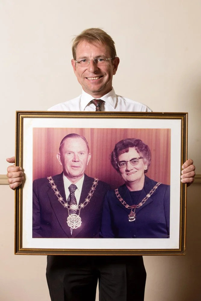 Pieter Van Rooyen is a hotel manager. He holds a framed 1960s colour photograph of his grandparents, Petrus Hendrik and Maria Suzanna Van Rooyen. P.H. Van Rooyen -who sports the regalia of his position as mayor of Virginia- was a Headmaster at Grey C