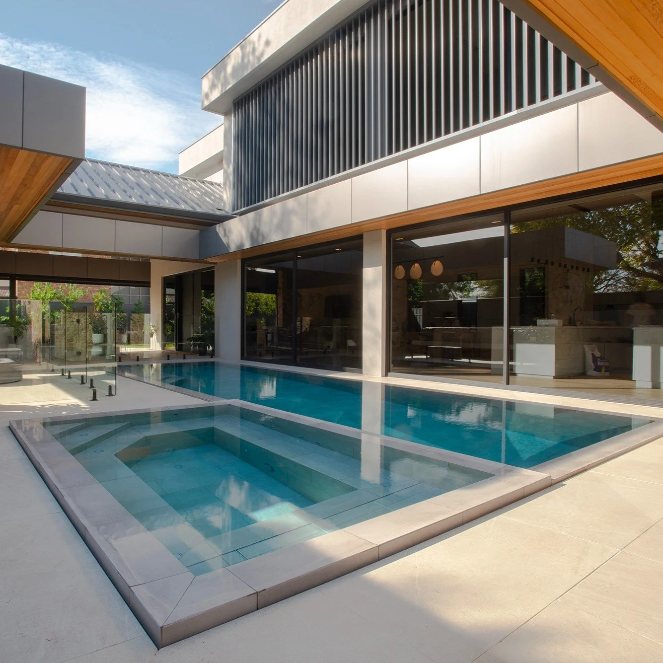 A custom concrete swimming pool and spa designed to bring the outdoor space together.

Simple lines, generous proportions and considered finishes create a space made for long summer days at home.

Get in touch with our team and let's start your dream