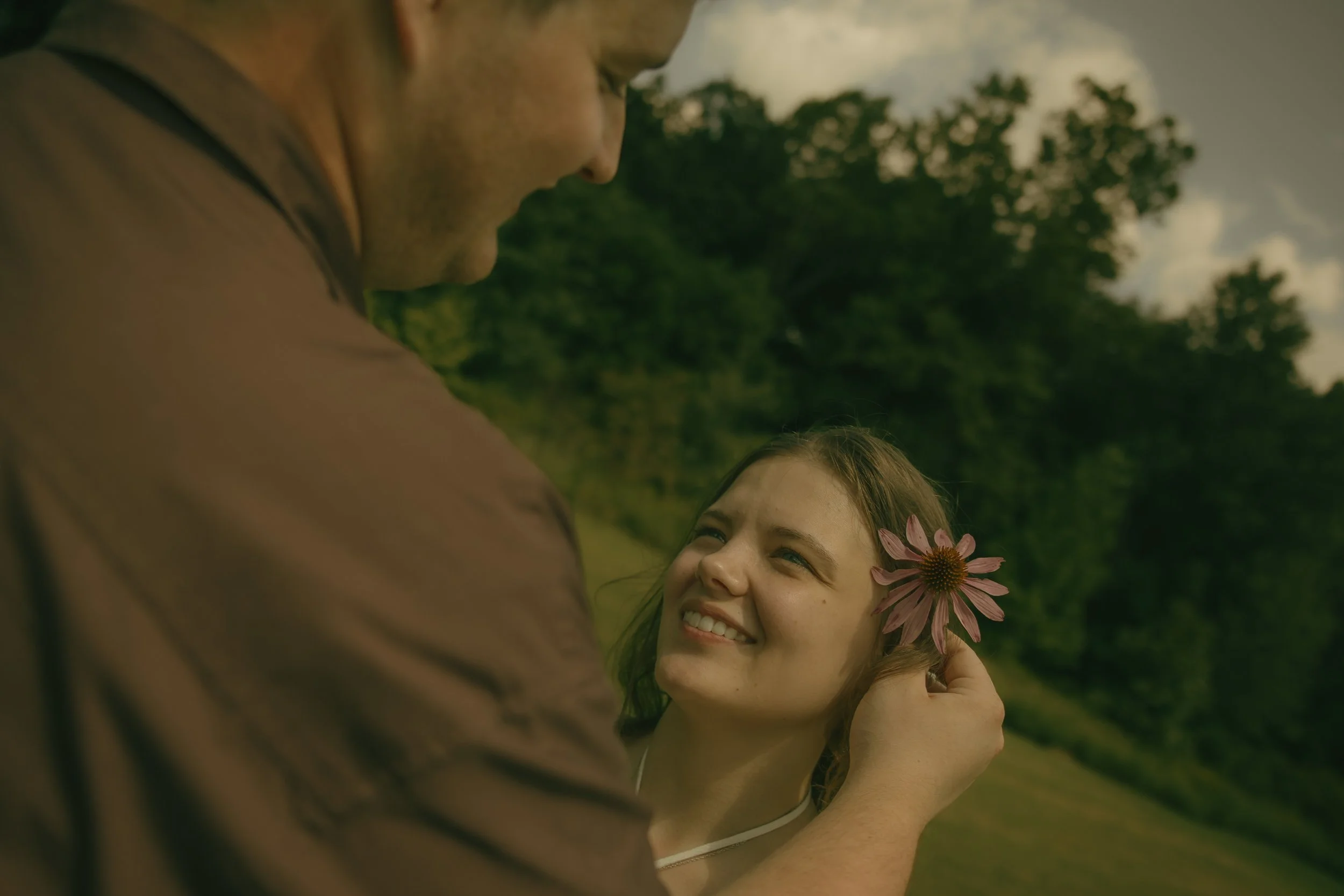 Couple sharing a sweet candid moment during an outdoor couples photography session