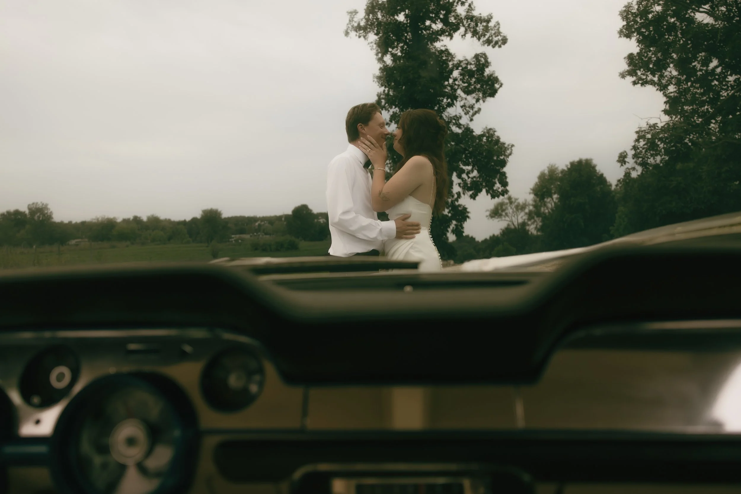 Bride and groom sharing a quiet moment outdoors during documentary-style wedding portraits