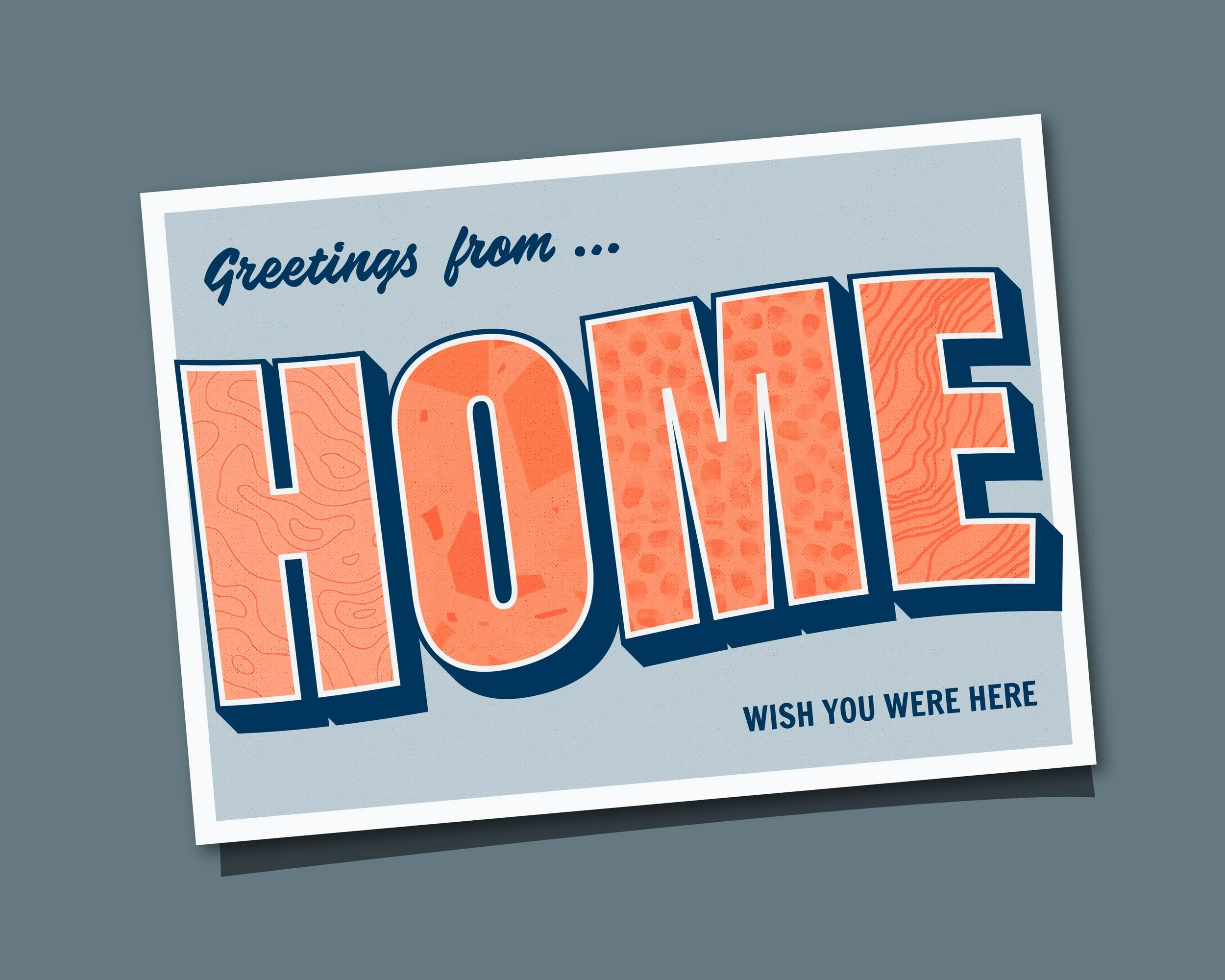Postcard with the message "Greetings from..." and the stylized letters "HOME" in bold orange with map-like patterns.