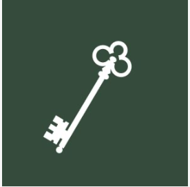 White vintage key with three rounded teeth on a dark green background.