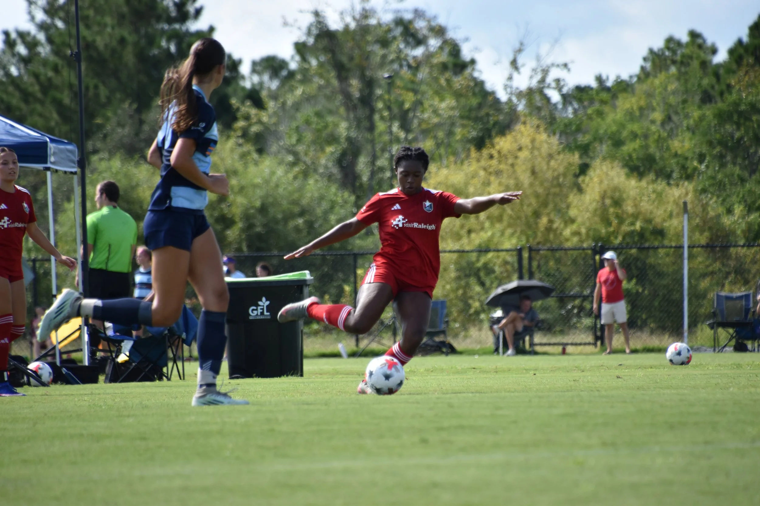 Michal Wilburn about to kick a soccer ball