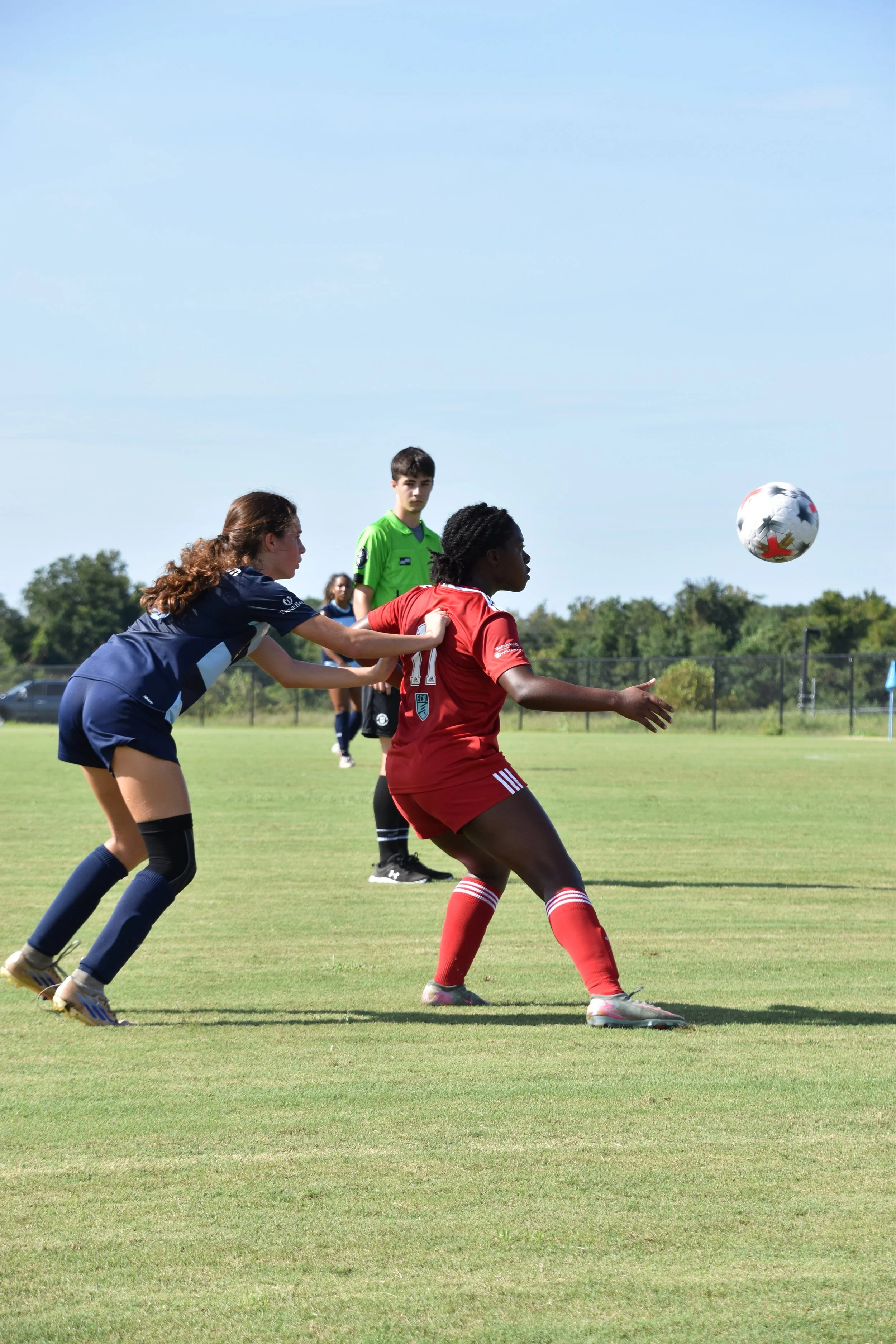 Michal Wilburn being pushed in the back during a throw-in