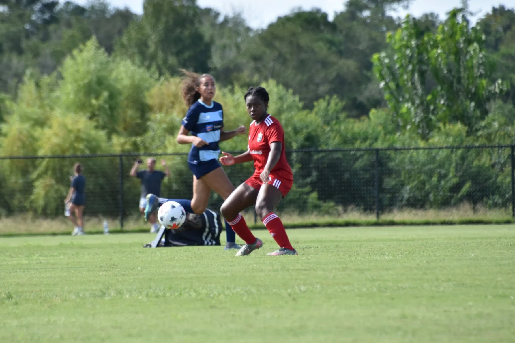 Michal Wilburn receiving a soccer pass