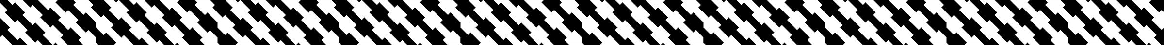 Close-up of a houndstooth patterned fabric in black and white.