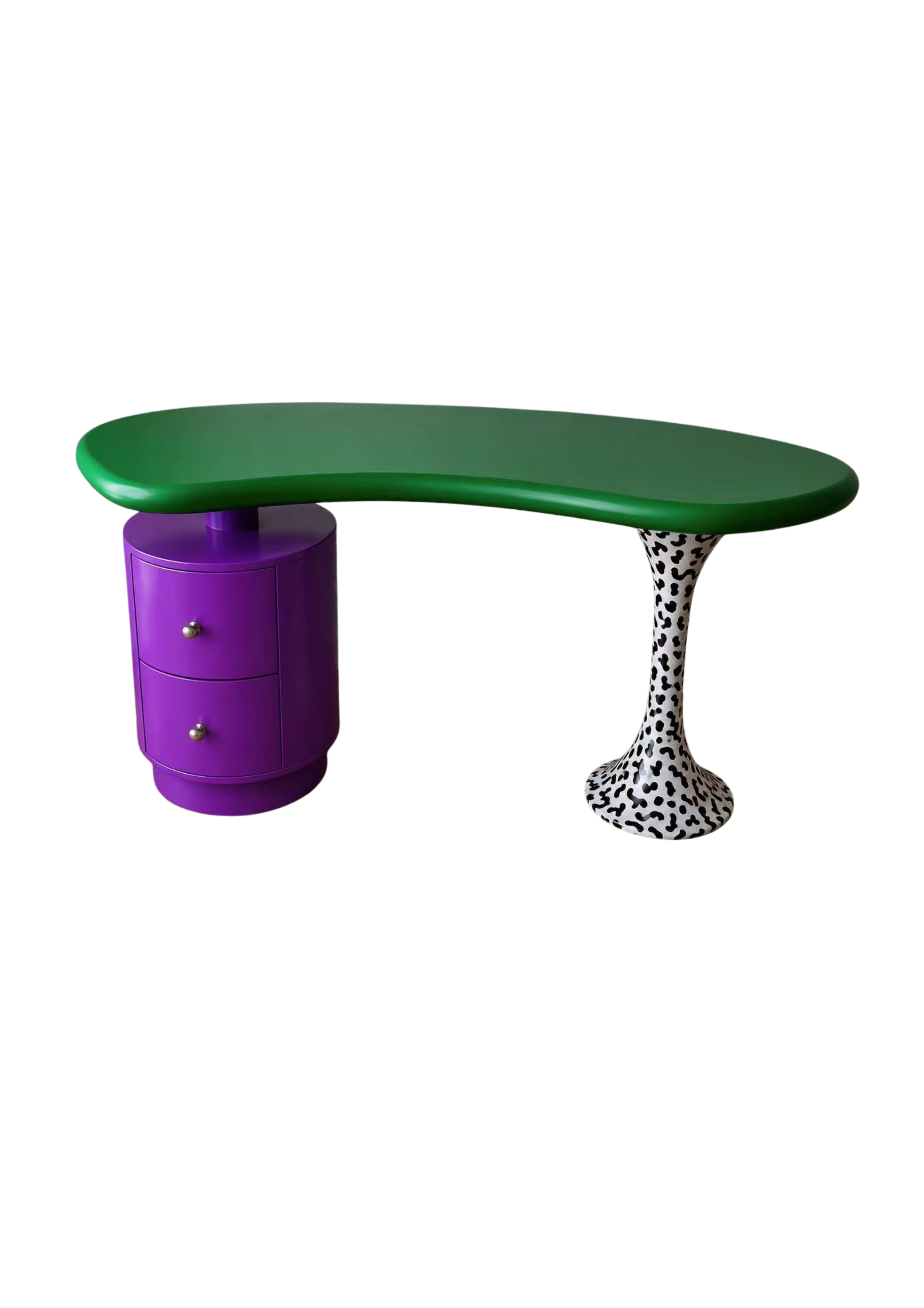 A modern, colorful piece of furniture with a purple cylindrical storage unit, a green curved tabletop, and a black-and-white spotted supporting column.