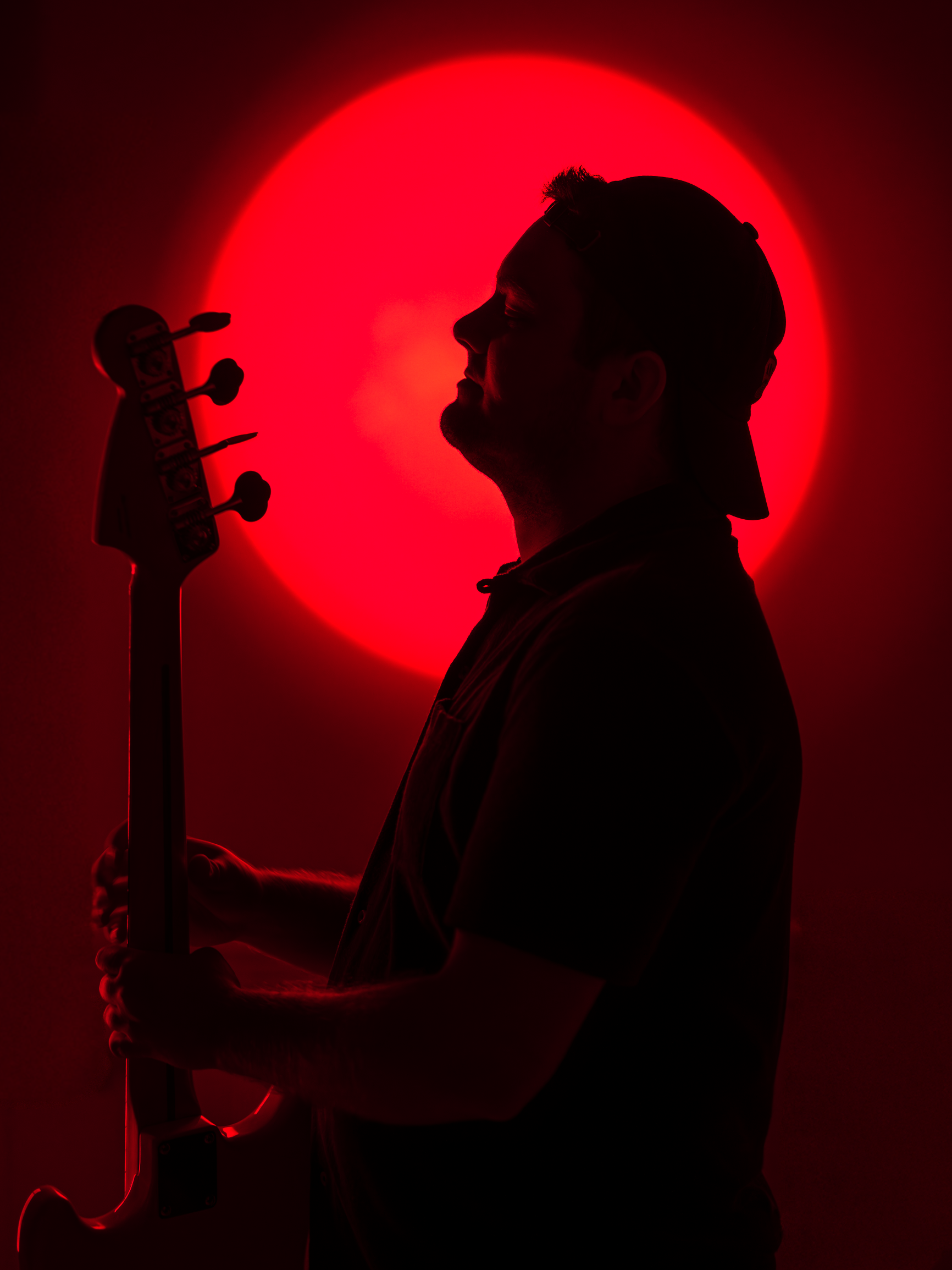 Bass Silhouette Under Crimson Glow1.png