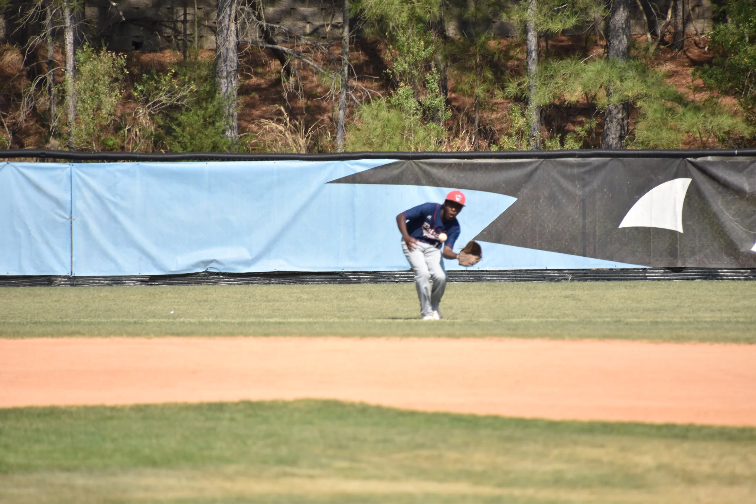 Gabriel Wilburn catching a baseball