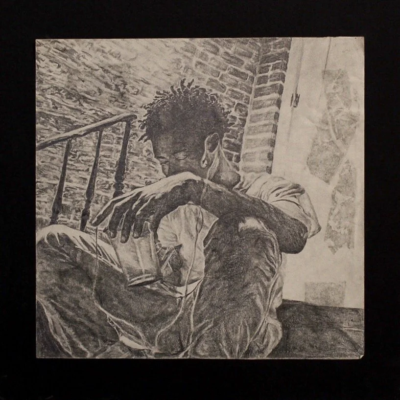 Black and white drawing of a person sitting on a bed, with one arm resting on their knee and their head resting on their arm, wearing glasses and large earrings. The background shows brick walls, a window, and a staircase railing.