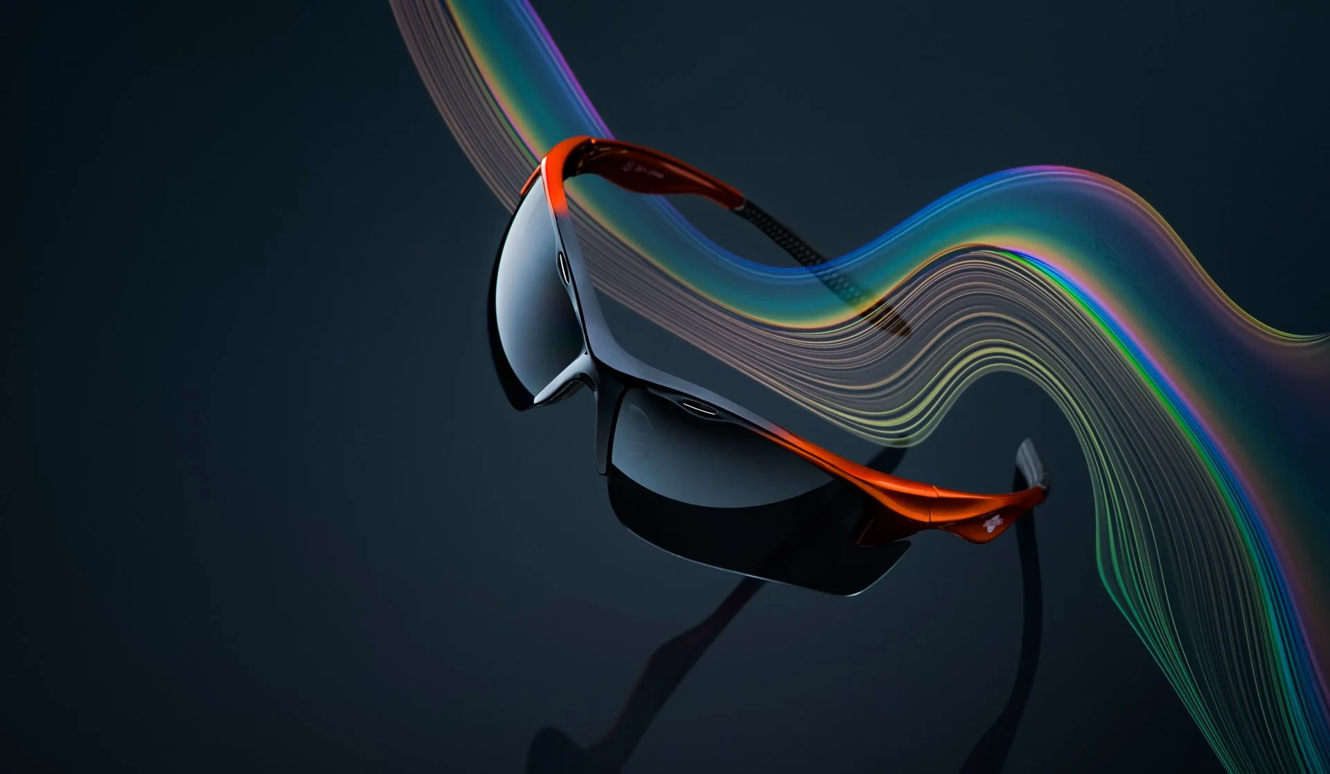 Futuristic black and orange sunglasses with rainbow light trails reflected on a dark background.