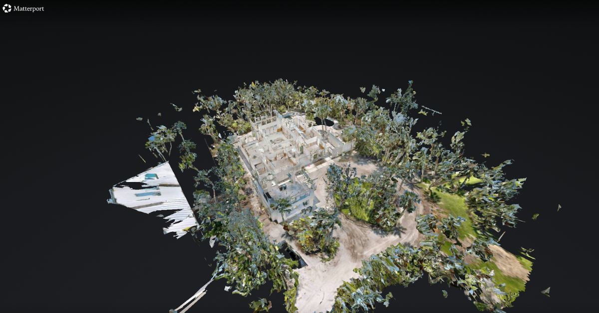 3D model of a house surrounded by trees and greenery, with a dark background.