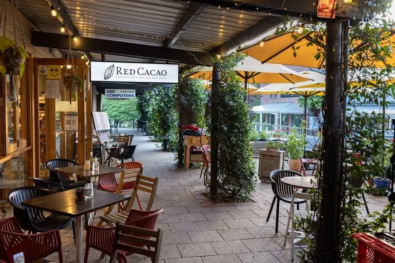 Cafes and outdoor seating on the main street in Stirling, Adelaide Hills, near the Avenue SDA homes