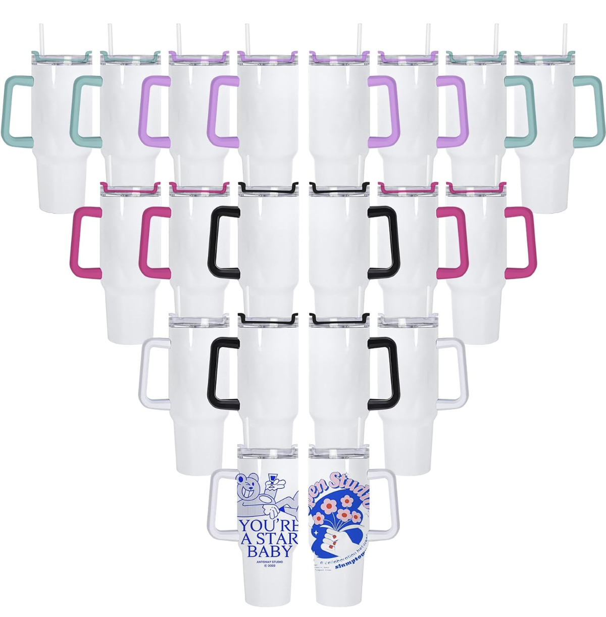 Multiple white tumblers with colorful handles arranged in a heart shape, some have printed designs, including one with a blue cartoon character, text saying "You're a star baby," and another with pink flowers and the text "Open Studio."