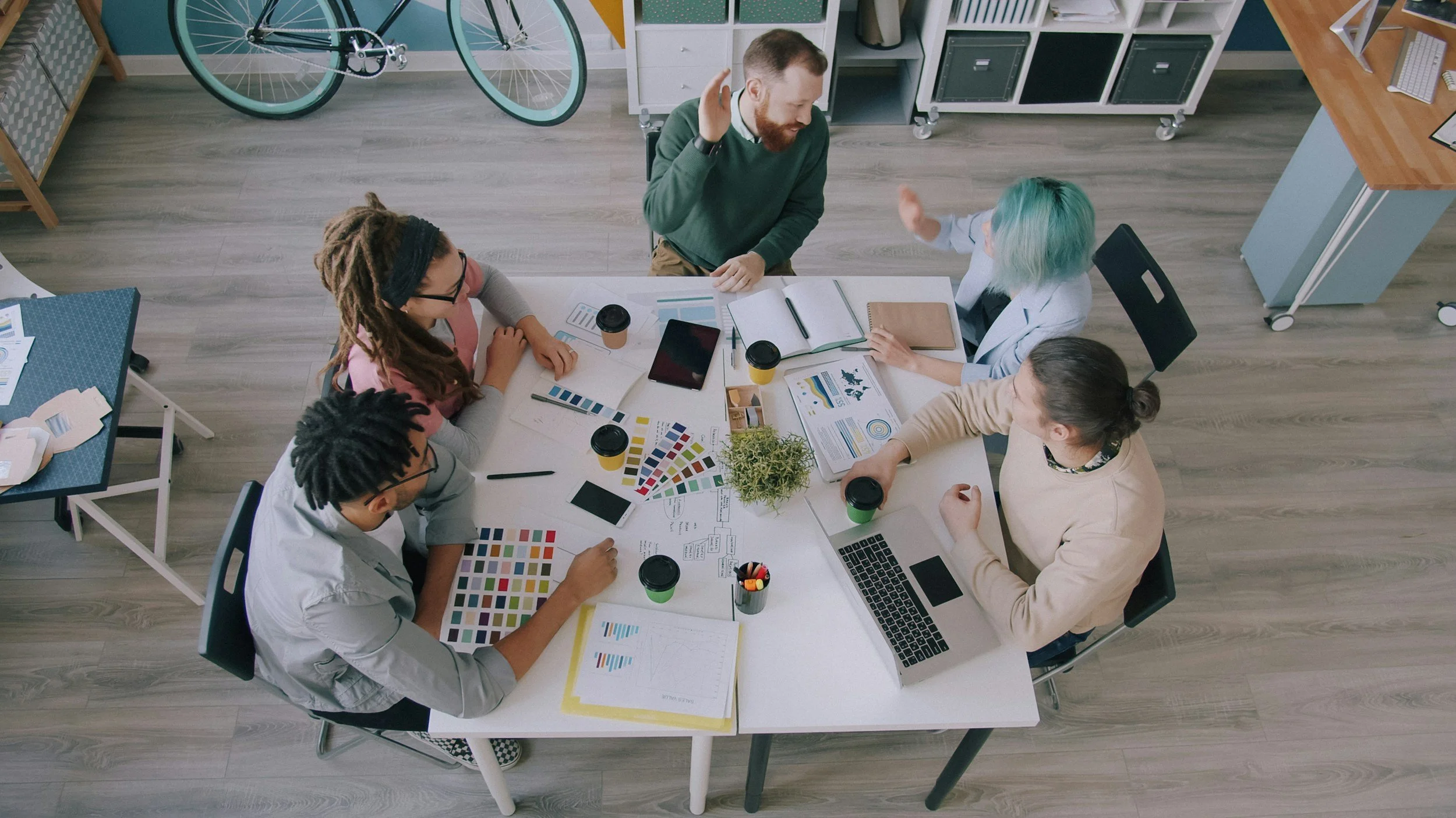 Team collaborating around a table during an organizational planning session.