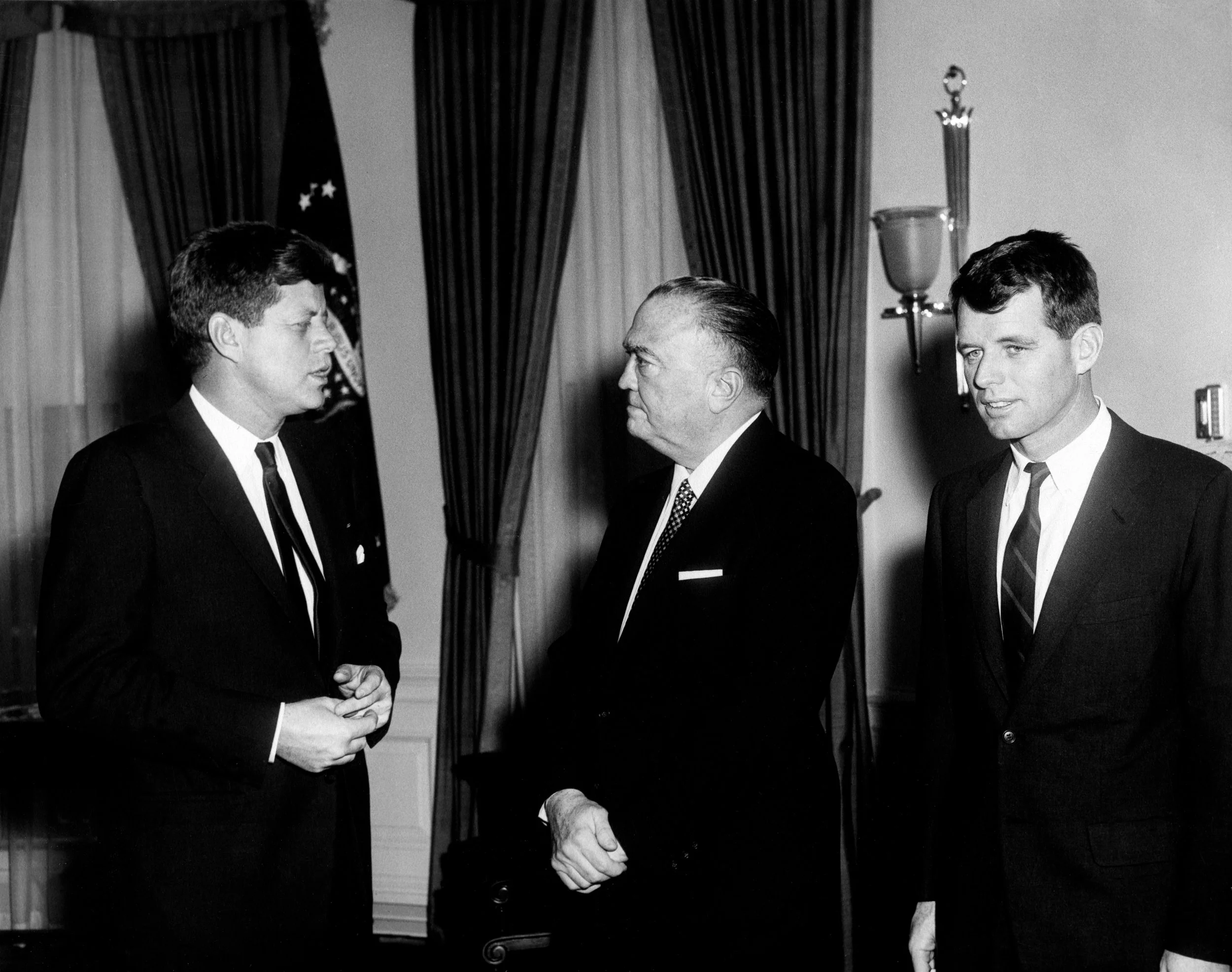 JFK and his brother, Attorney General Robert F. Kennedy, meet with FBI Director J. Edgar Hoover on February 23, 1961.