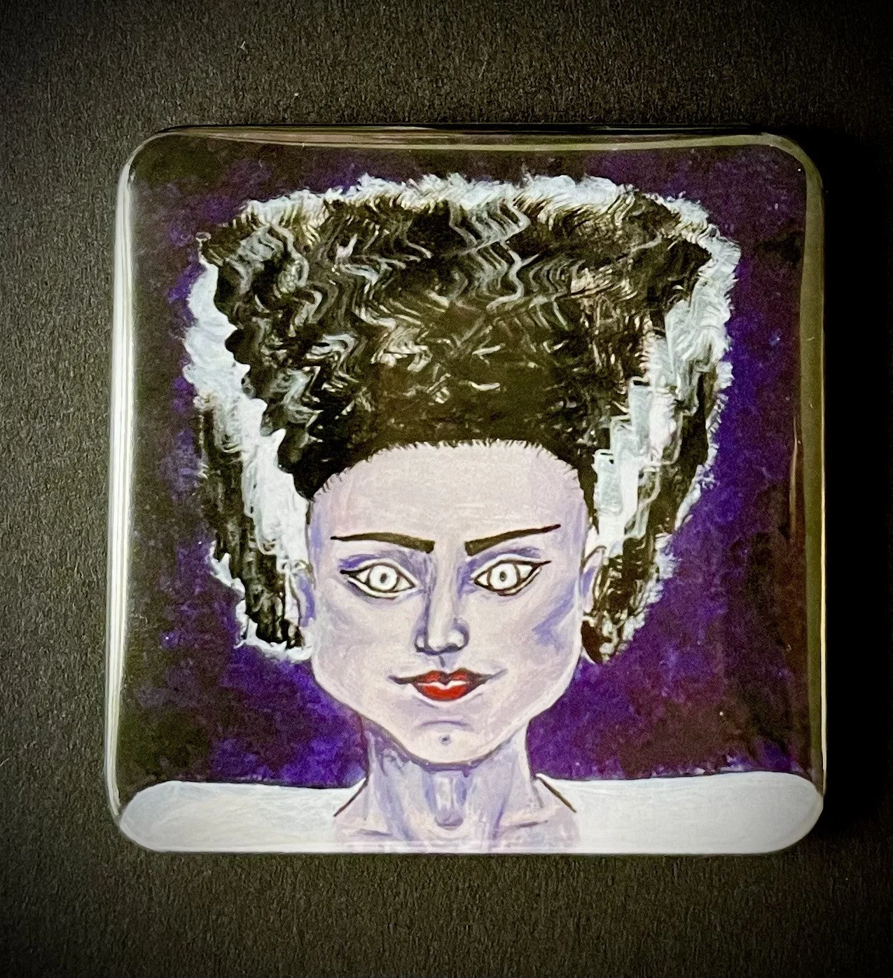 A painting of a woman with dark curly hair styled to stand up, with a purple background. She has light skin, striking makeup, and is smiling slightly.