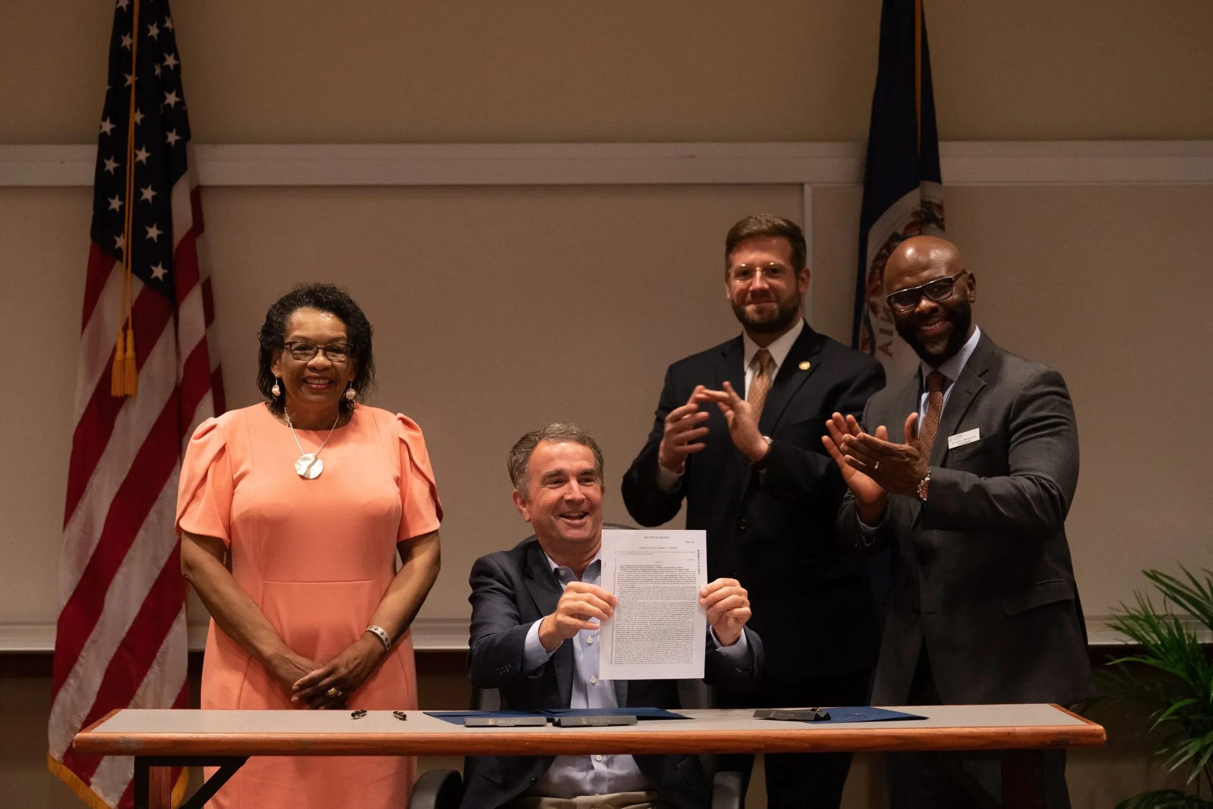 Evan Feinman celebrating passage of landmark legislation with Governor Northam