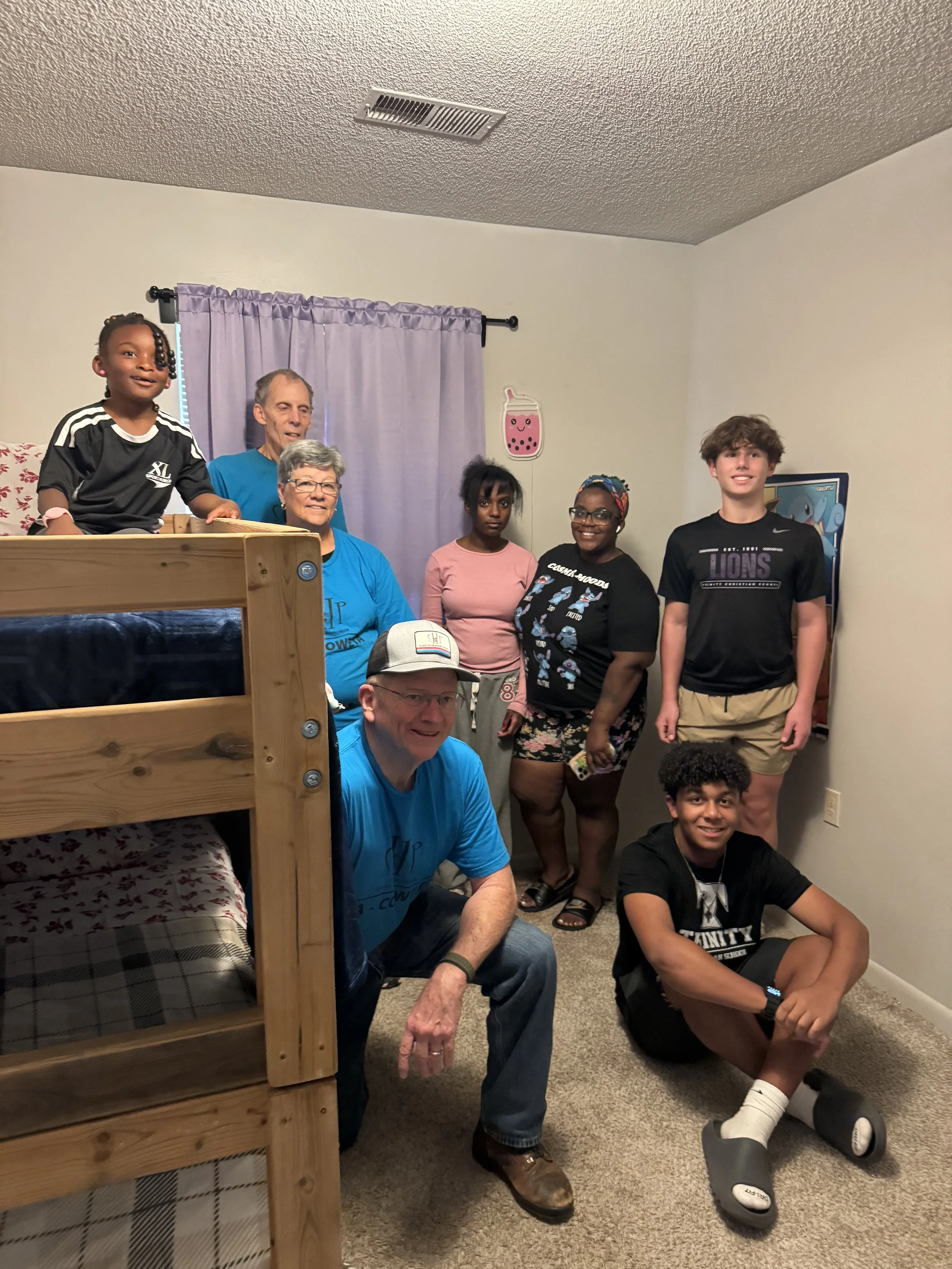 Gabriel Aldama volunteering with others on a community service project.