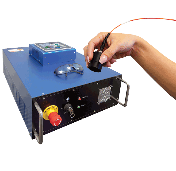 Person holding a fiber optic cable connector near a blue electronic device with switches and buttons, including an emergency stop button, on a black background.