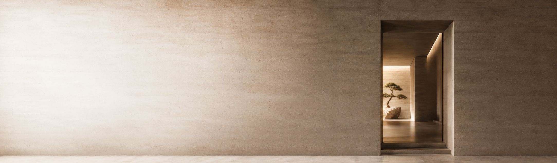 A minimalist interior with a textured beige wall and a small opening leading to a room with a bonsai tree and rocks.