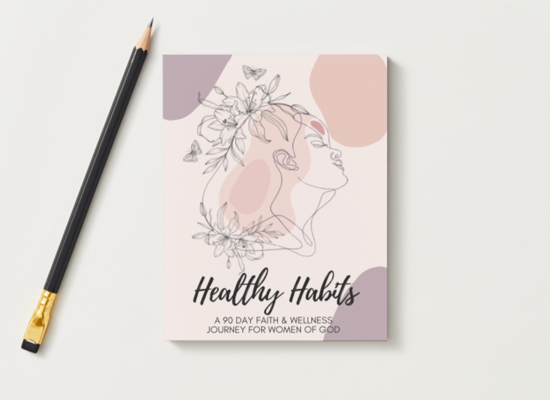 A booklet titled "Healthy Habits" with a subtitle reading "A 90 Day Faith & Wellness Journey for Women of God." The cover features a line drawing of a woman's profile intertwined with flowers and butterflies, with pastel-colored abstract shapes in the background, placed on a white surface with a black and gold pencil beside it.