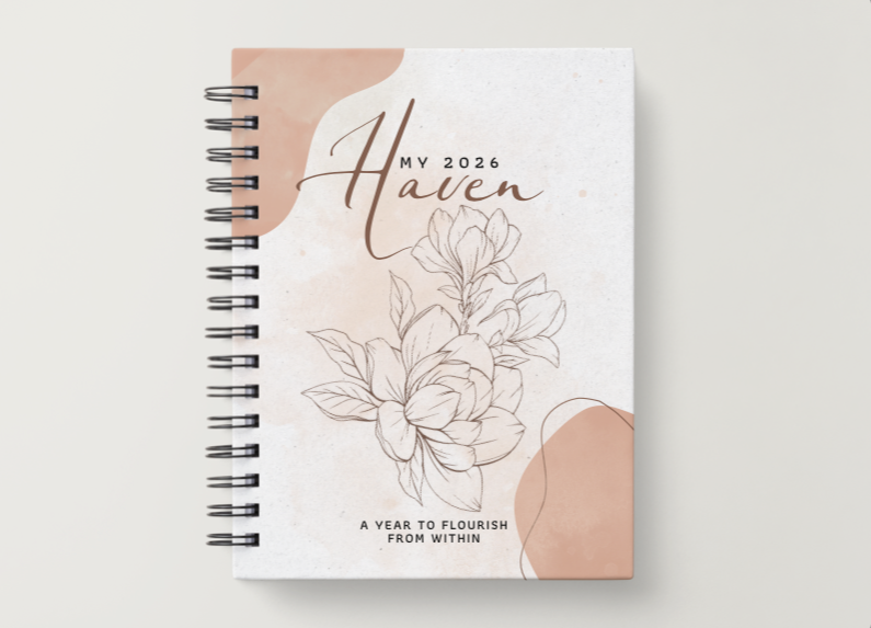 A 2026 planner with a floral design and modern typography, titled "My 2026 Haven", resting on a white surface.