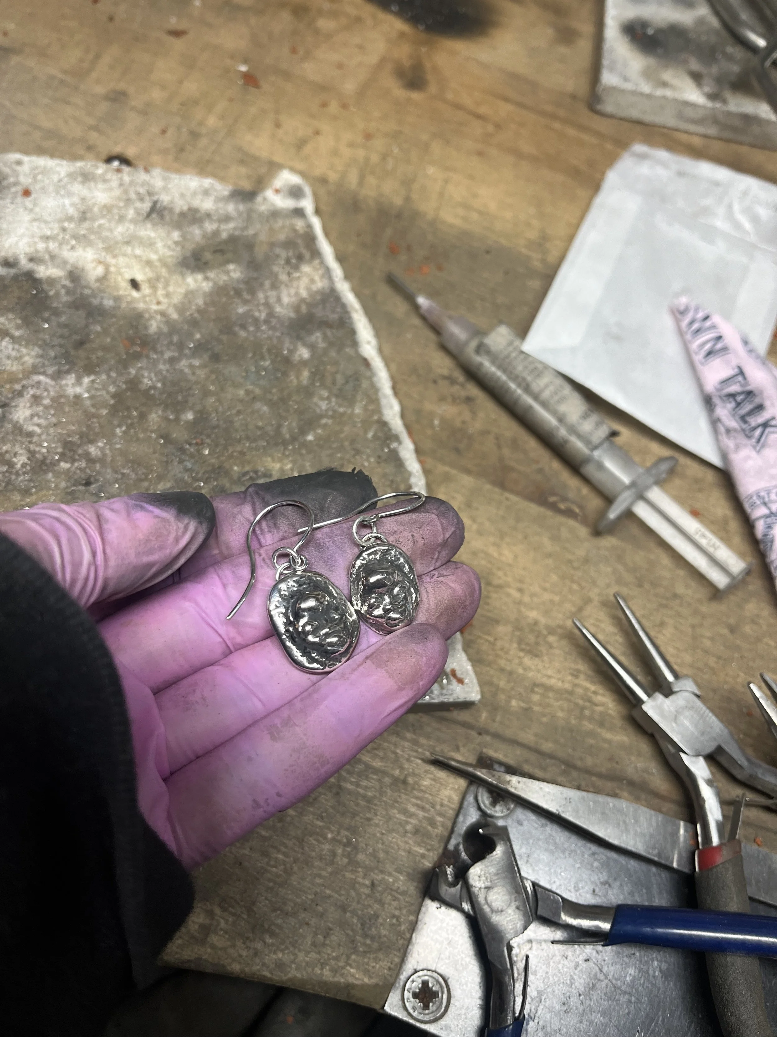 Hand carved "face" drop earrings