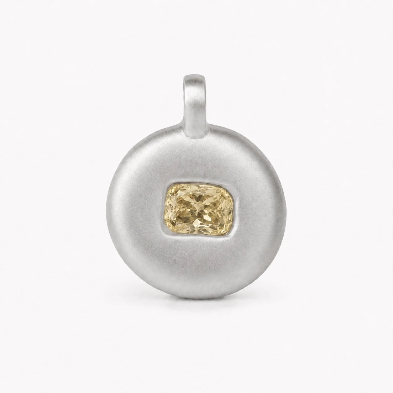 Matte 18k 9k white gold round pendant with pale yellow cushion-cut diamond in a bezel setting
