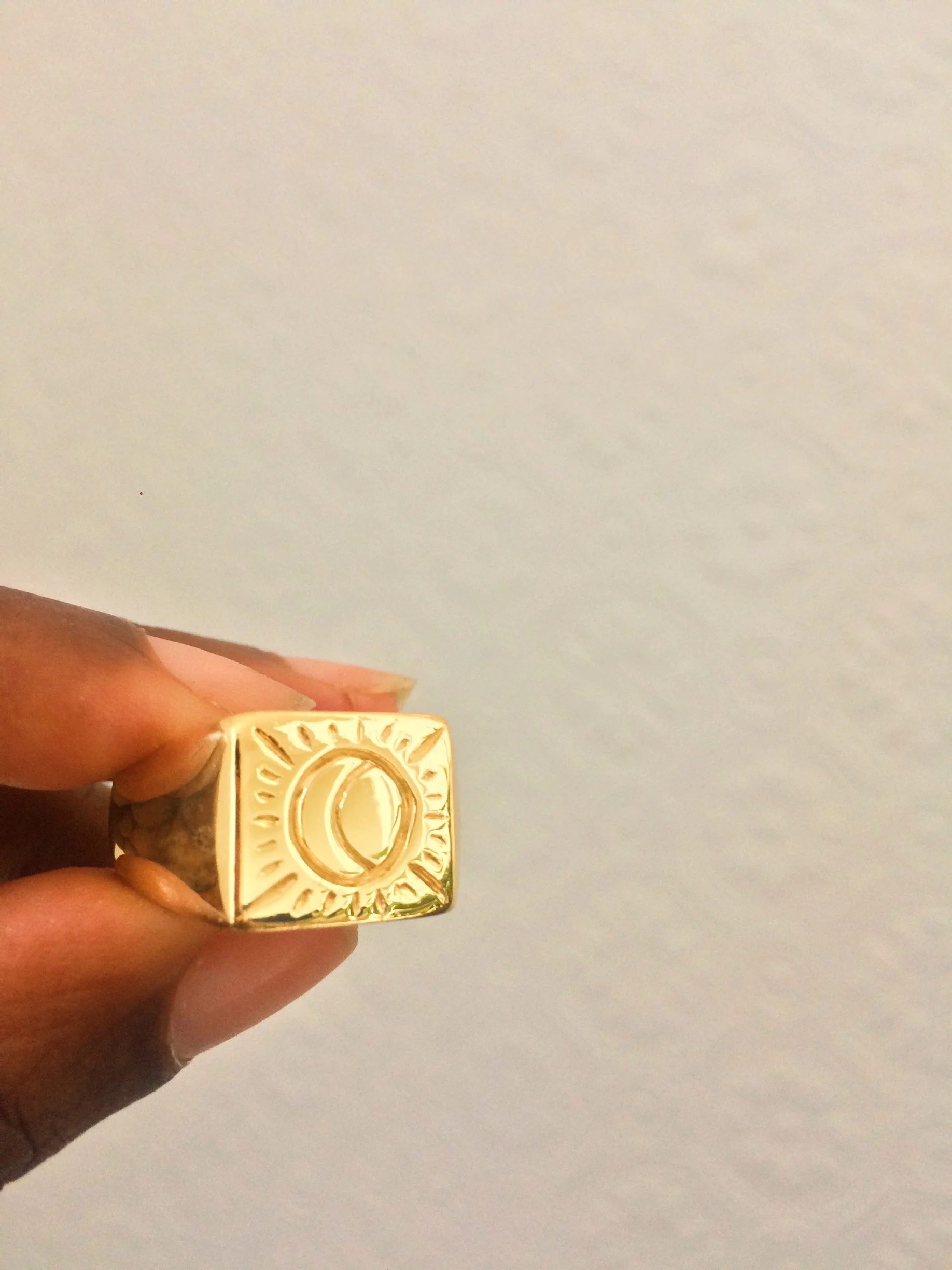 A hand carved bespoke 9k signet ring